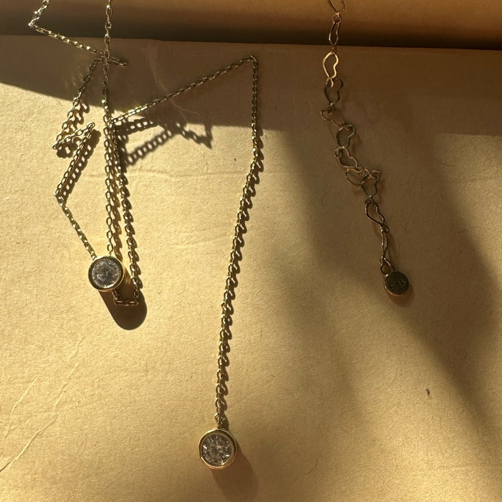 Sarah Briggs gold drop necklace with diamonds